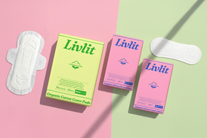 Livlit organic cotton pads and packaging on a pink and green gradient background