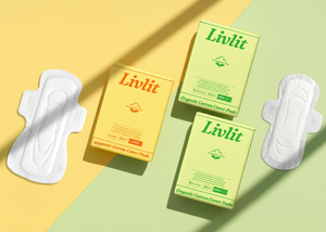 Livlit sanitary pads and boxes on a yellow and green background